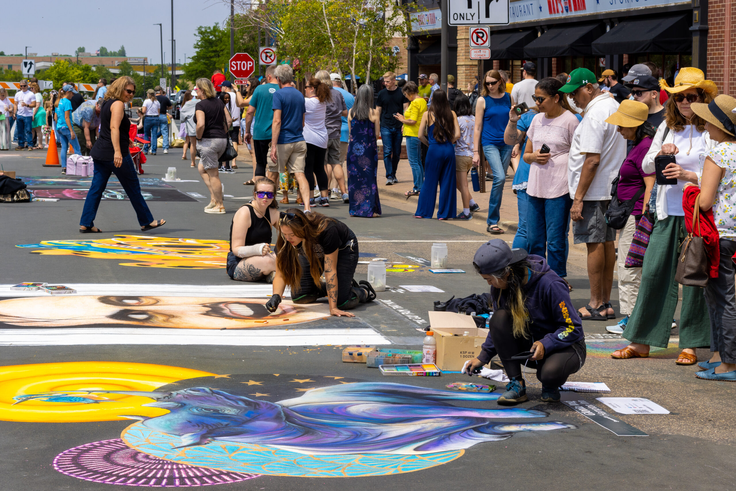Artists working away on their pieces during chalkfest