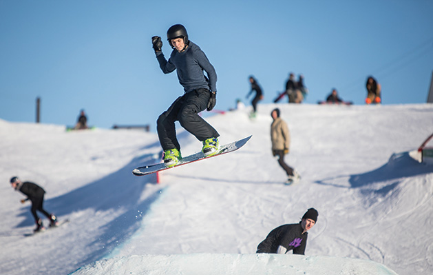 A snowboarder goes airborne at the Elm Creek Park Reserve