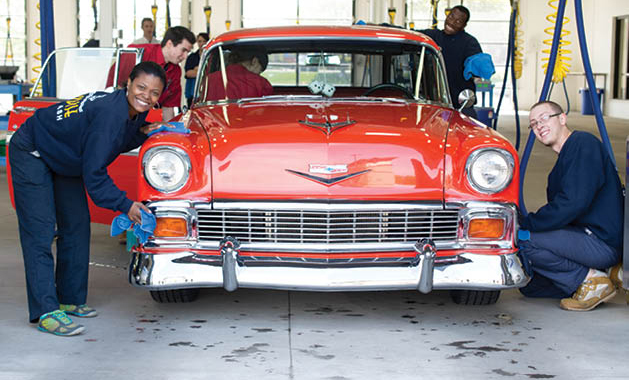 The Paradise team washing a vintage Chevy Bel Air.