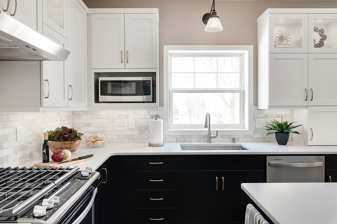 The Letourneaus had one word in mind for the kitchen remodel: aesthetic. The timeless kitchen includes two-toned cabinetry, gold hardware and marble subway tile blacksplash. 