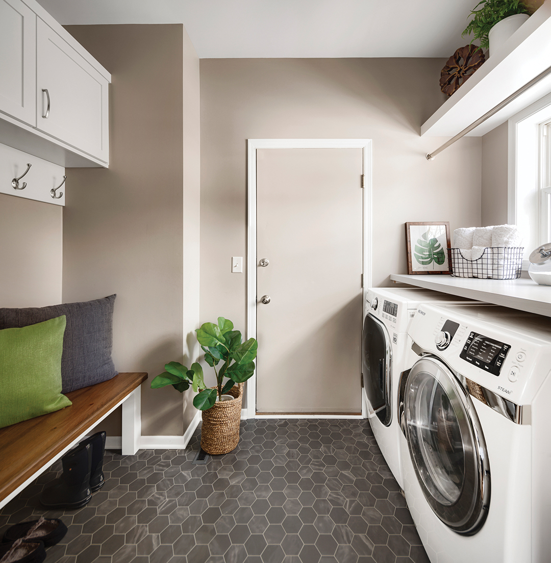 The main point of entry—the laundry room/mudroom—needed a functional makeover. By eliminating the small kitchen pantry, the Letourneaus opted to create more storage in the room.