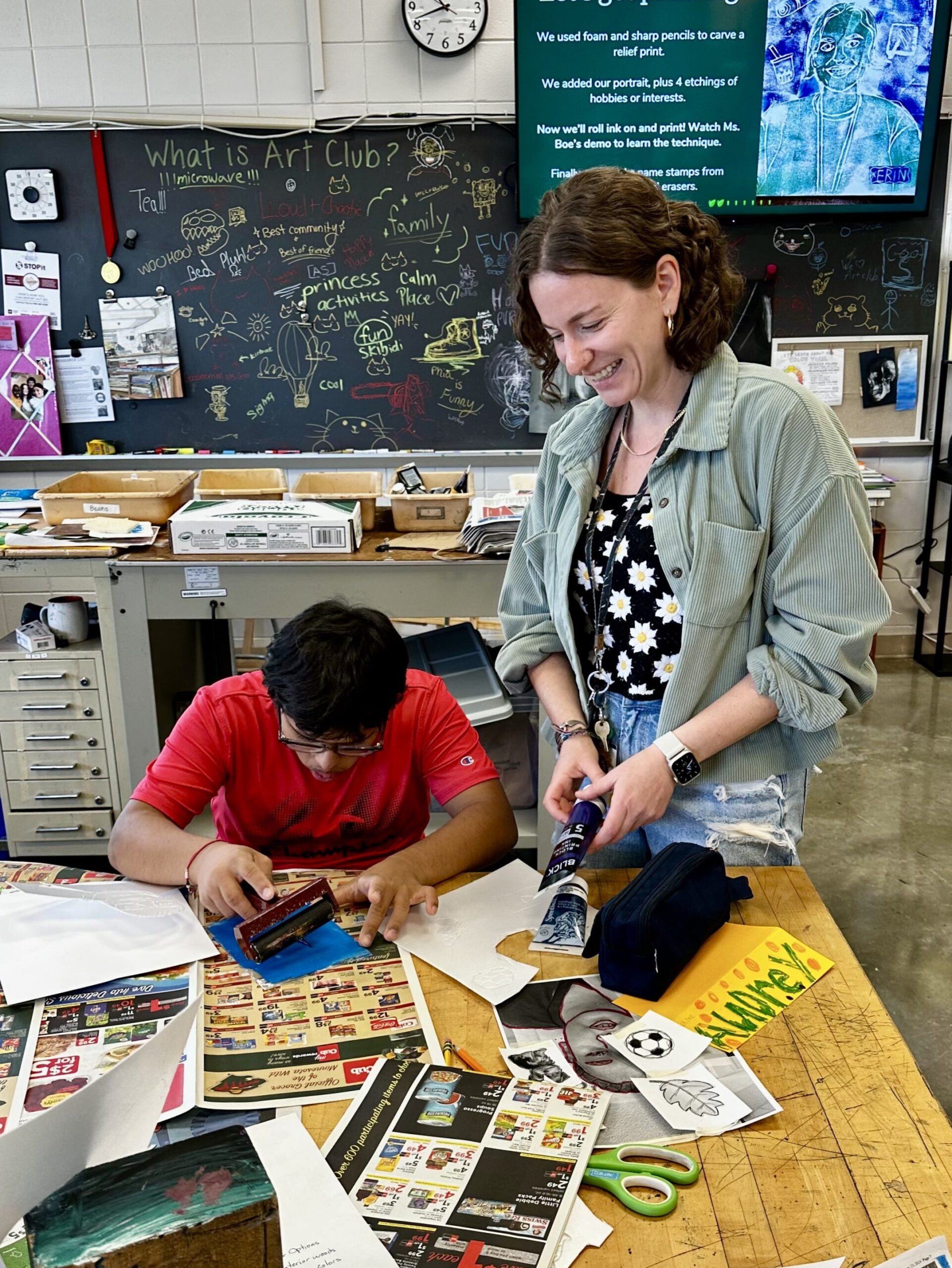 Maple Grove Senior High School art teacher Erin Boe with a student.