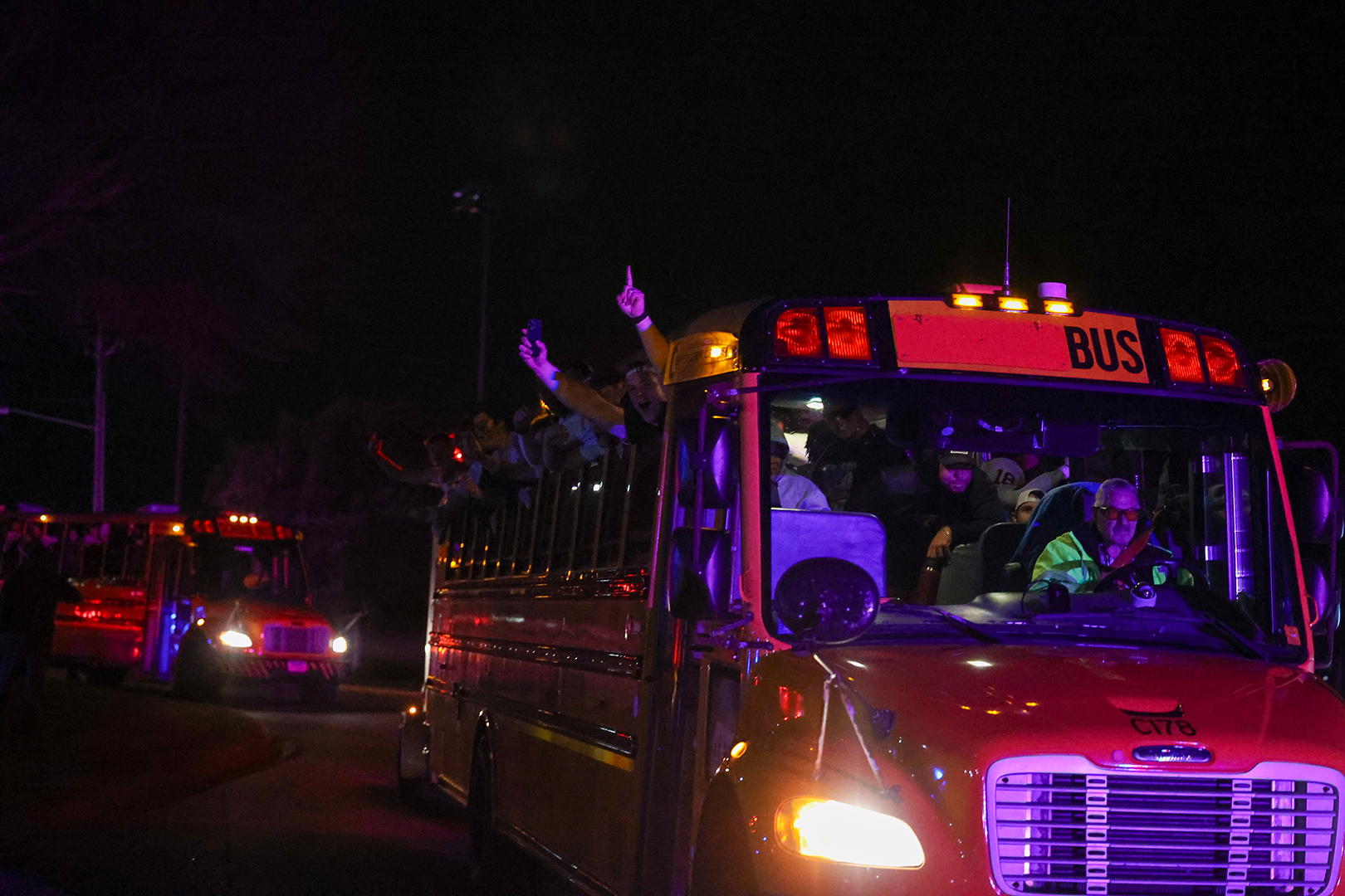 The team receives a police and fire truck escort back to Maple Grove Senior High School.