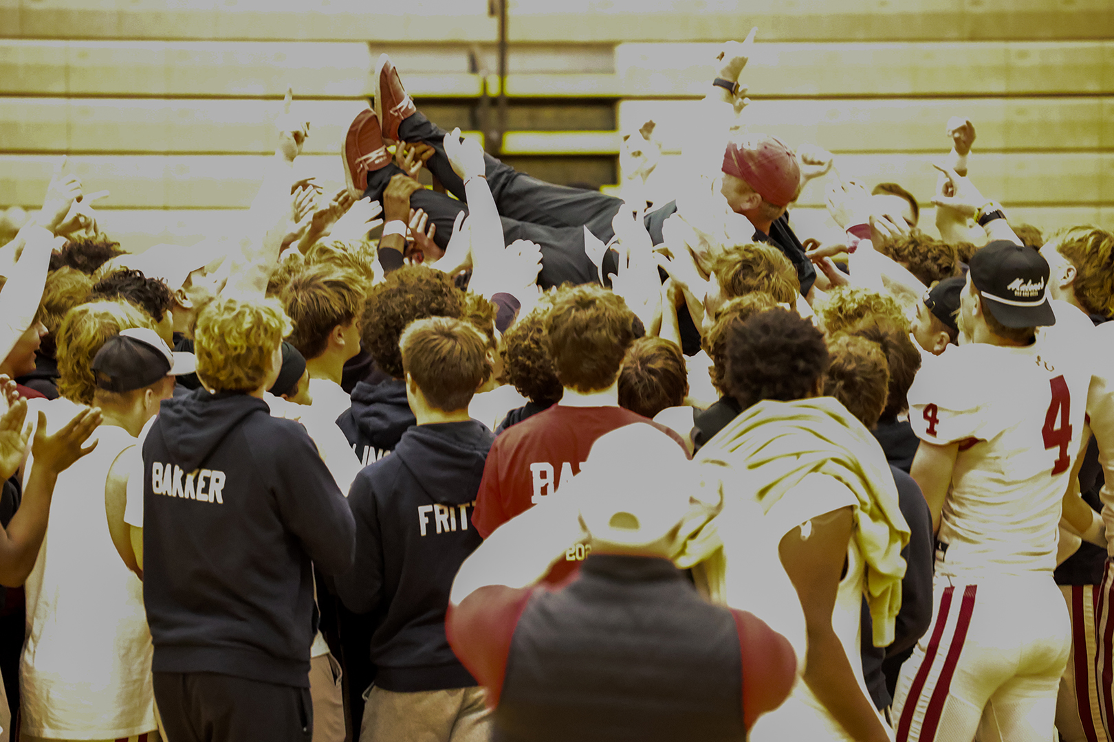 The Crimson Team celebrates with head coach Adam Spurrell.