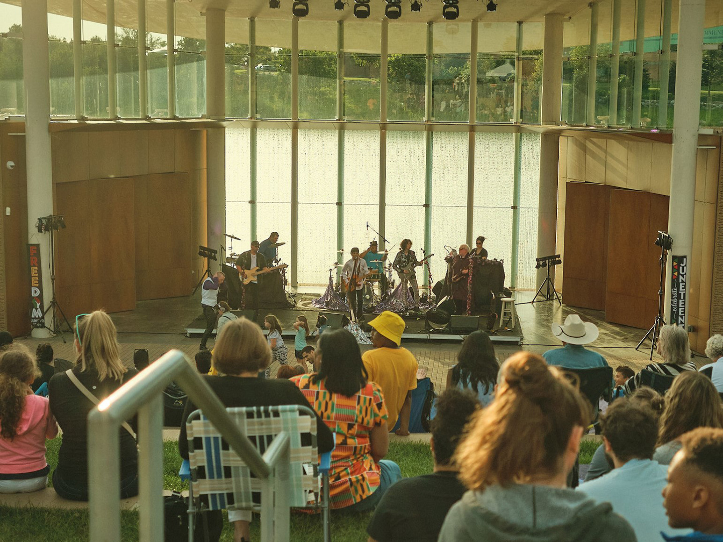 Crowd at Maple Grove's Juneteenth event watching live music.