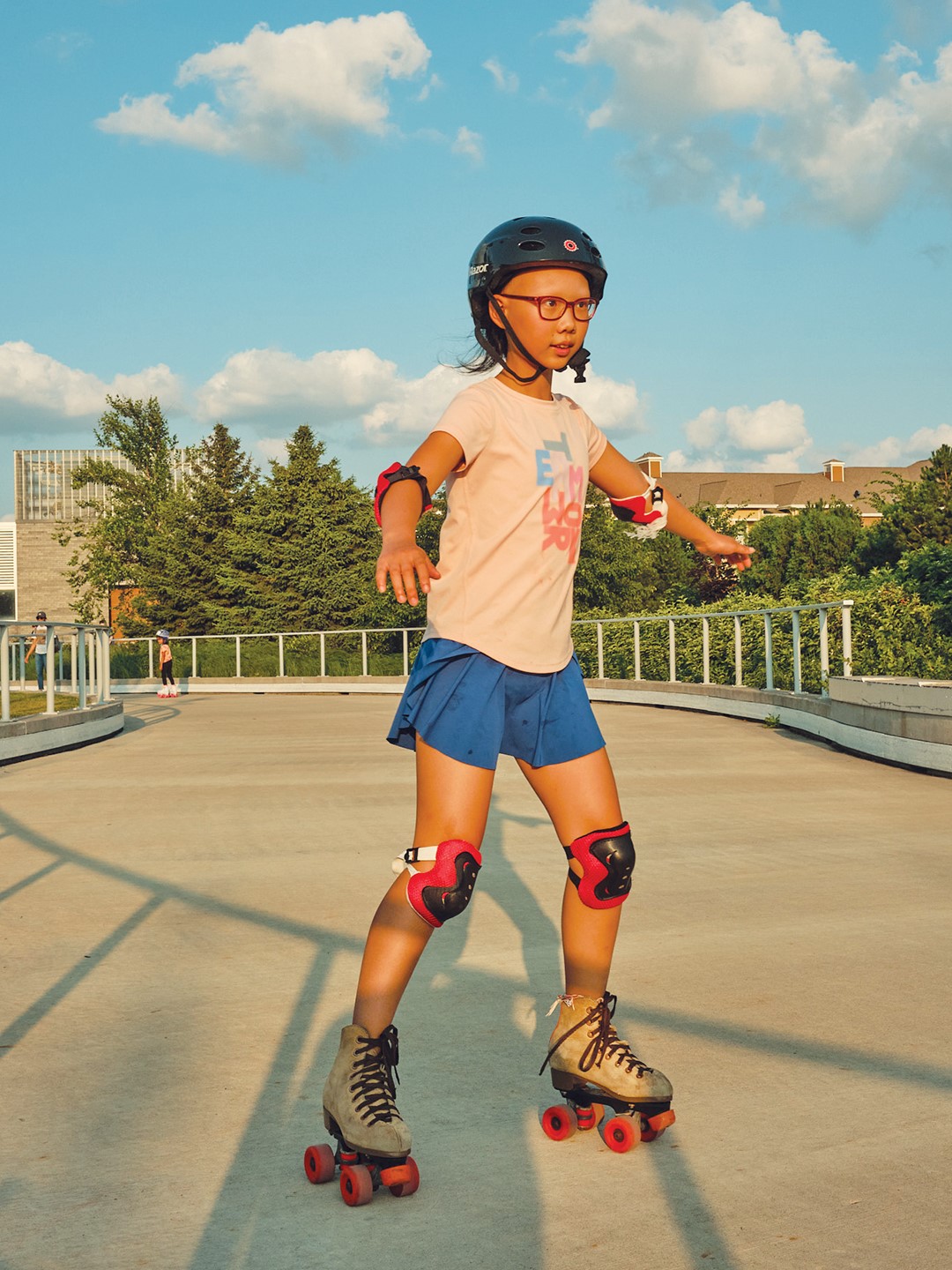 Girl roller skating at the Central Park loop in Maple Grove.