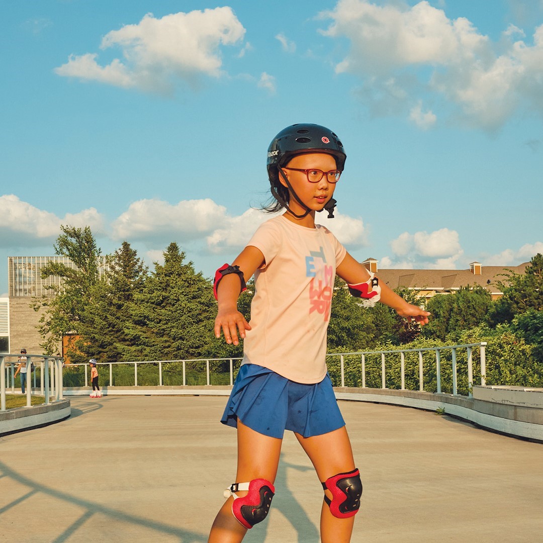 Girl roller skating at the Central Park loop in Maple Grove.