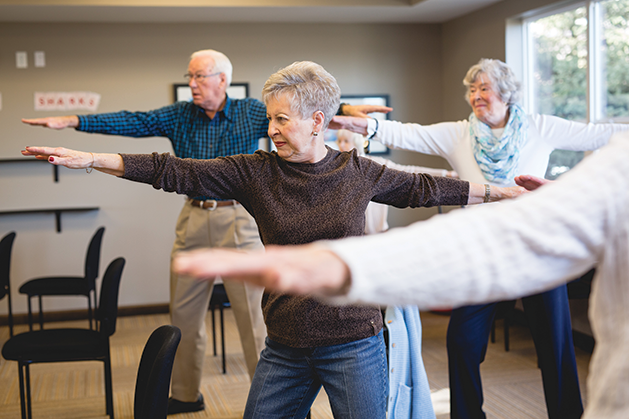 A yoga class at SilverCreek on Main senior living community.