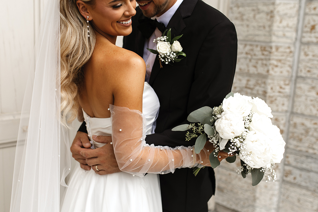 Mariah and Tom Arko saw stormy skies melt into a golden sunset on their wedding day.