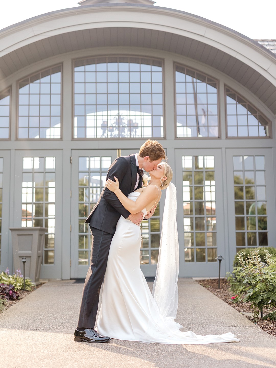 Brooke Vogt’s “something borrowed” was her floor-length veil, studded with pearls, which her friend had worn for her own wedding.