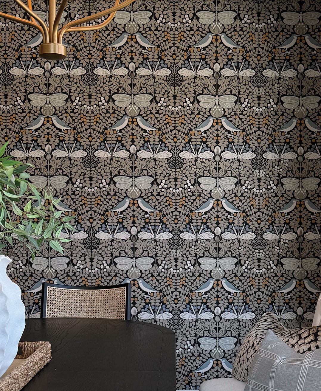 Designer Tina Wherry says dining spaces can often get lost in open concept homes. “To transform this once-transitional zone into a final destination, I introduced a bold, immersive wallpaper to establish a clear visual boundary,” she says. The dramatic print anchors the room and adds what Wherry describes as a sense of cohesive luxury to the space. “The result is a warm, intentional space that doesn’t just look beautiful, but actively invites you to slow down, sit a little longer and connect,” she says.